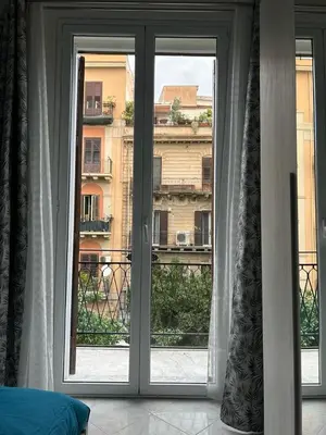a room with a window with a view of a building at Casa Maria Rosa Deliziosa in Palermo