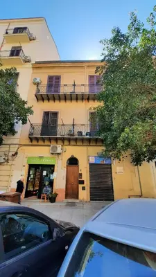 a car parked in front of a building at Casa Maria Rosa Deliziosa in Palermo