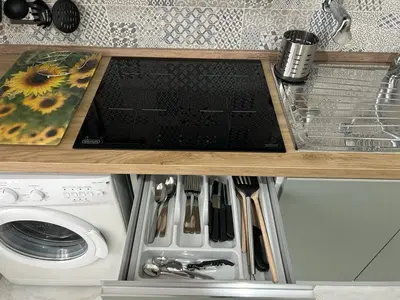 a kitchen counter top with a stove and a sink at Casa Maria Rosa Semplice in Palermo