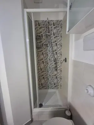 a bathroom with a shower with a toilet and a shower at Casa Maria Rosa Semplice in Palermo