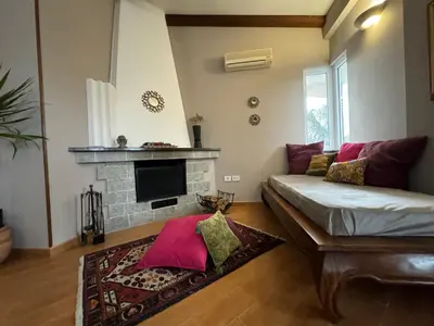 a living room with a couch and a fireplace at Casa Lucale in Palermo