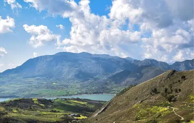a view of a mountain range with a lake at Nice Apartment In Portella Di Mare in Portella di Mare
