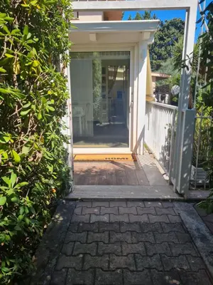 an open door to a house with a patio at Marina Mondello House comfort in Mondello