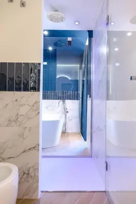 a bathroom with a tub and a sink at Le Dame di Sicilia Sicilian Vintage Rooms in Palermo
