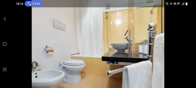 a bathroom with a toilet and a sink at Palermo sweet house in Palermo