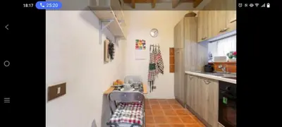 a kitchen with a sink and a chair in it at Palermo sweet house in Palermo