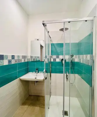 a bathroom with a sink and a shower at La Casa di Elisa Mini Apartment - Palermo in Palermo