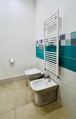 a bathroom with a toilet and a sink in it at La Casa di Elisa Mini Apartment - Palermo in Palermo