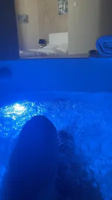 a person swimming in a pool with blue lights at Mael Superior Room in Palermo