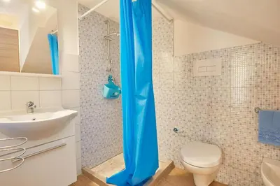 a bathroom with a shower with a toilet and a sink at CASA FATIMA in Castellammare del Golfo