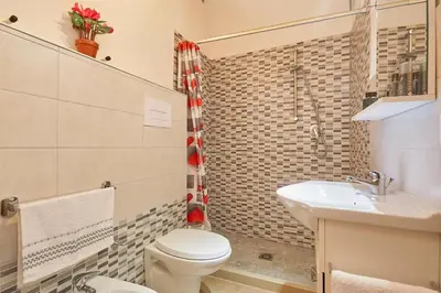 a bathroom with a toilet and a sink at CASA FATIMA in Castellammare del Golfo
