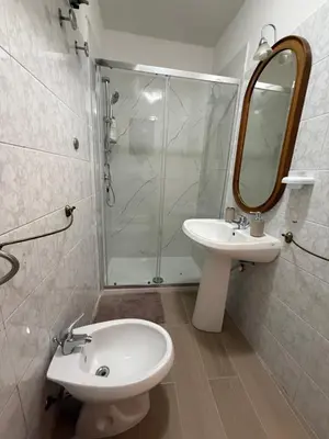 a bathroom with a sink and a mirror at Al Vicolo in Palermo