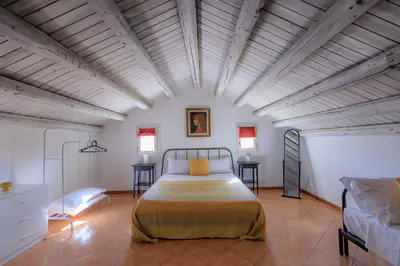 a bedroom with a large bed in a room at Casa Querencia rooms in Palermo