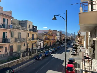 a view of a city street with cars parked at M'AMA apartment in Ficarazzi