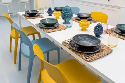 a kitchen and dining room with a table and chairs at Addaura Home in Palermo
