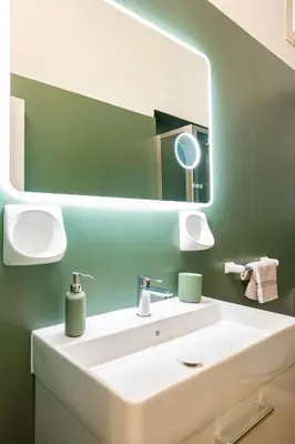a bathroom with a white sink and a mirror at Bibi house a San Giovanni degli Eremiti in Palermo