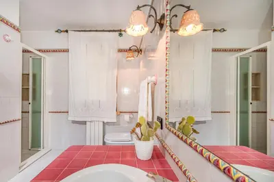 a bathroom with a sink and a mirror at Villa Miceli in Scopello
