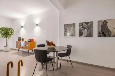 a dining room with a table and chairs at 70 Lab Apartment in Palermo