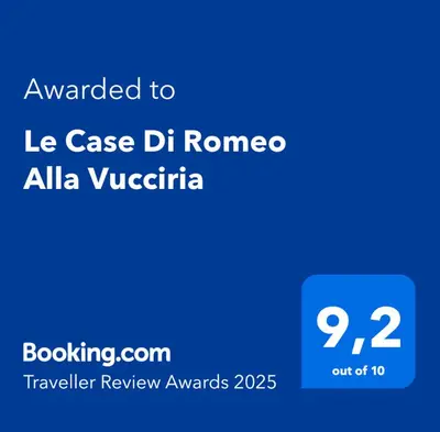 a screenshot of a cell phone with the text awarded to le case dh roma at Le Case Di Romeo Alla Vucciria in Palermo
