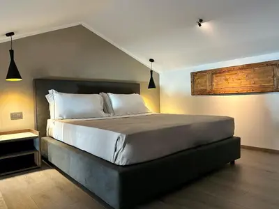 a bedroom with a large bed in a room at Palazzo Liberty Unique Hotel by Geocharme in Palermo