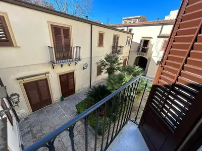 an external view of a building with a balcony at Corte dei Re di Palermo Apartment in Palermo