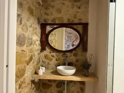 a bathroom with a sink and a mirror at casa di campagna iobio in Alcamo