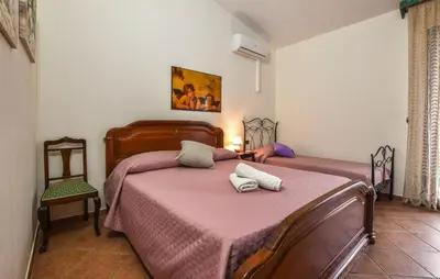 a bedroom with a bed with two towels on it at 4 Bedroom Stunning Home In Trappeto in Trappeto