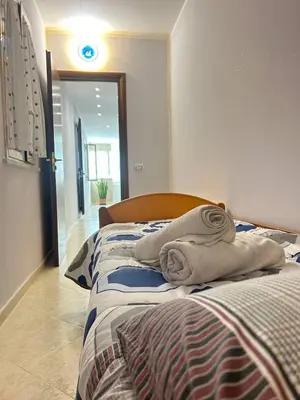 two beds with towels on them in a bedroom at Casa Julia in Palermo