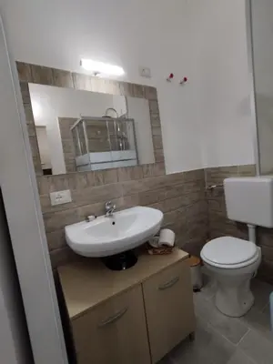 a bathroom with a sink and a toilet at Casa Veni Ka in Palermo