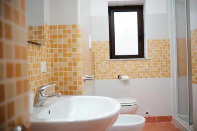 a bathroom with a sink and a toilet at Al bastione della pace in Palermo