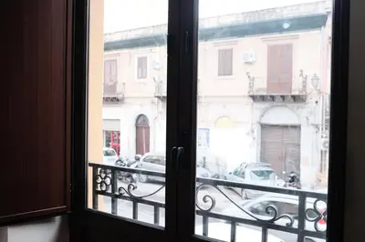 a view of a city street from a window at Al bastione della pace in Palermo