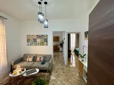 a living room with a couch and a table at La Dimora di Anna e Ciccio in Casteldaccia