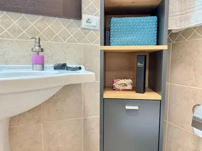 a bathroom with a sink and a sink at La Dimora di Anna e Ciccio in Casteldaccia