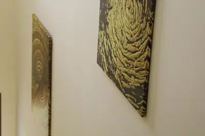a piece of art hanging on a wall at Casita Garden&Spa in Carini
