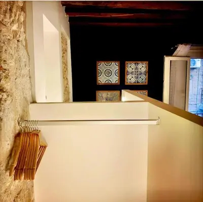 a white refrigerator in a room with tiles on the wall at Casa Verderame in Palermo