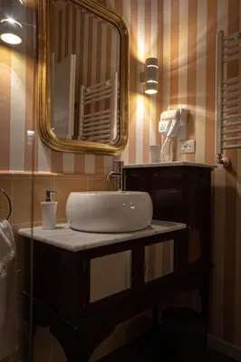 a bathroom with a sink and a mirror at Casa Verderame in Palermo