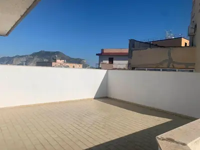 a white wall on top of a building at GEORGE PENTHOUSE Attico PALERMO in Palermo