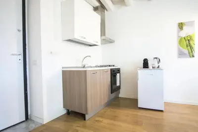 a kitchen with a sink and a stove at Casa Gelsomino POOL&SEAVIEW in Palermo