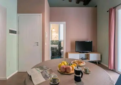 a room with a table with a plate of fruit on it at Appartamenti Franco il Conte in Bagheria
