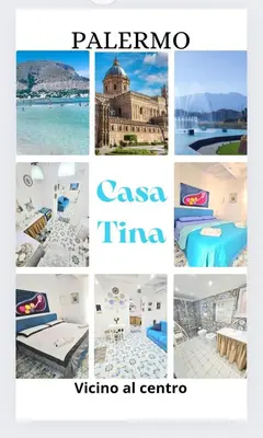 a living room with a blue couch and a table at SUITE AND RELAX TINA a 2 passi dal centro e al foro italico in Palermo