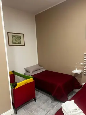 a small room with two beds in it at Maqueda Vibes in Palermo