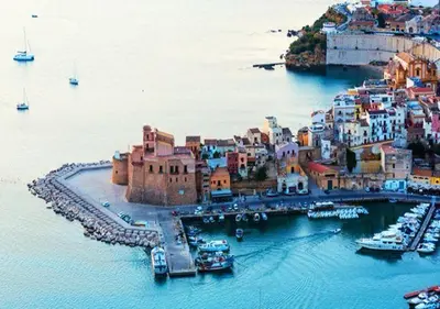 an aerial view of a town on the water at Casa vacanza la finestra sul porto in Castellammare del Golfo