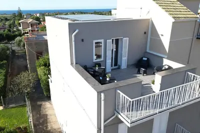 an aerial view of a white house with a balcony at Da 'Nfacci Affittacamere in Carini