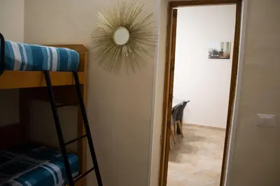 a room with a bunk bed and a mirror at CASA MAGIEM in Palermo
