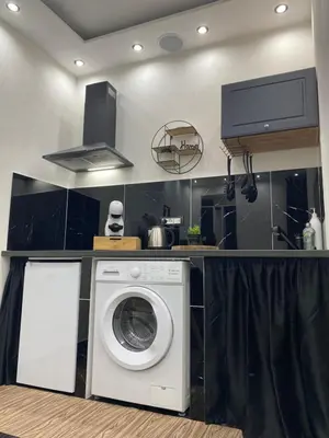 a kitchen with a washing machine in a kitchen at Holiday home Joy in Palermo