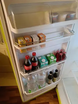 an open refrigerator filled with lots of food and drinks at We # Are ai Cassarelli in Palermo