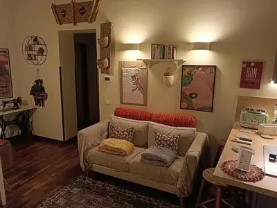 a living room with a couch and a table at We # Are ai Cassarelli in Palermo