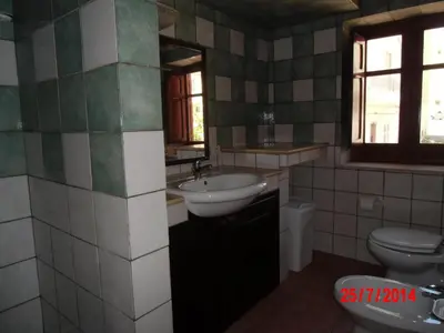 a bathroom with a sink and a toilet at Holiday home Santa Flavia in Santa Flavia