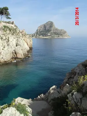 a body of water with an island in the distance at Holiday home Santa Flavia in Santa Flavia