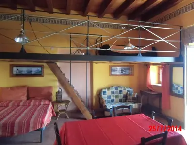 a room with a bed and a loft bed at Holiday home Santa Flavia in Santa Flavia